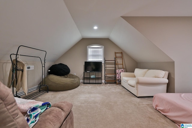 living room featuring lofted ceiling and light carpet