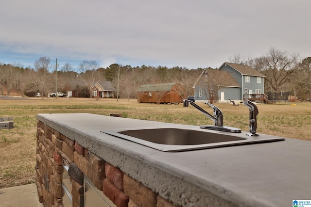 entry to storm shelter featuring a lawn