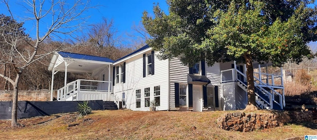 back of house with a porch