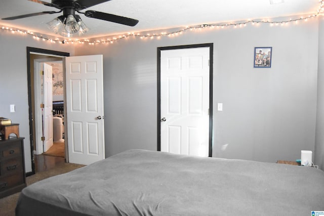 carpeted bedroom featuring ceiling fan