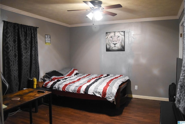 bedroom featuring crown molding, dark wood-type flooring, and ceiling fan