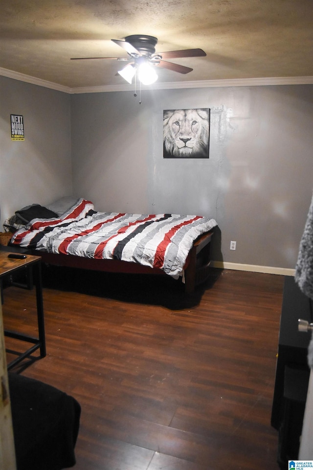 bedroom featuring dark wood-type flooring, ceiling fan, and crown molding