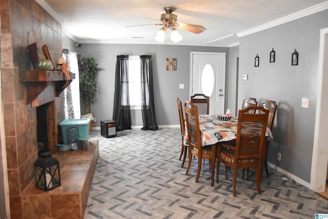 dining space with ornamental molding and ceiling fan