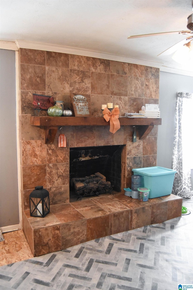 room details featuring crown molding, ceiling fan, and a fireplace