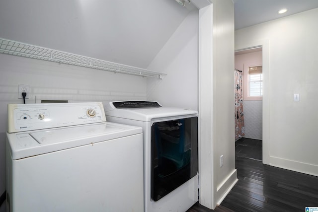 laundry room featuring washer and dryer and dark hardwood / wood-style floors