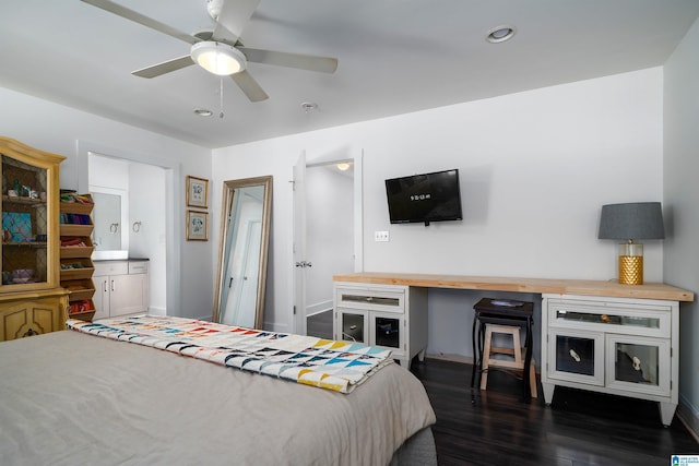 bedroom with dark hardwood / wood-style floors and ceiling fan