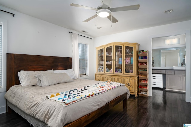 bedroom with dark hardwood / wood-style floors and ceiling fan