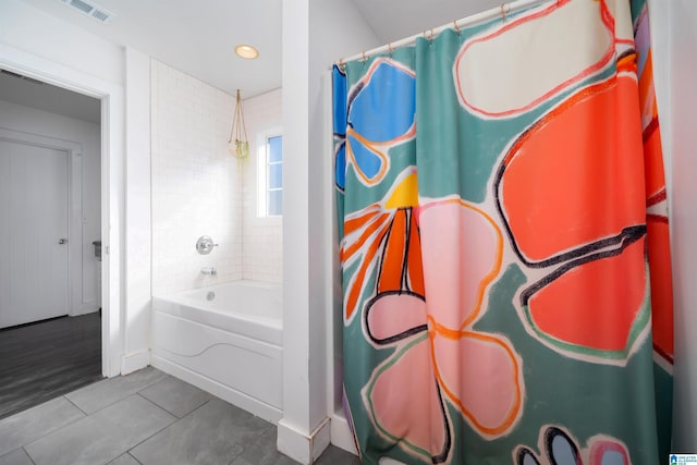 bathroom featuring tile patterned floors and shower / tub combo