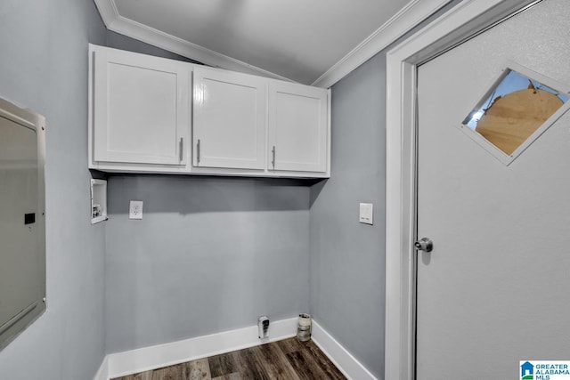 clothes washing area with cabinets, ornamental molding, washer hookup, and dark hardwood / wood-style flooring