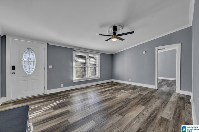 foyer featuring crown molding, ceiling fan, and dark hardwood / wood-style flooring