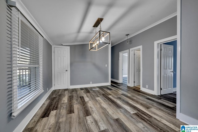 unfurnished dining area featuring dark hardwood / wood-style flooring and ornamental molding