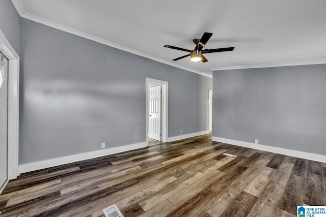 unfurnished room featuring ceiling fan, ornamental molding, and dark hardwood / wood-style flooring