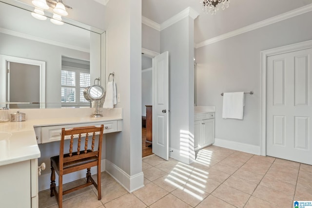 bathroom with tile patterned flooring, crown molding, vanity, and a chandelier