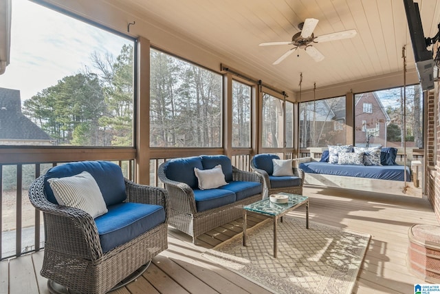 sunroom / solarium with wooden ceiling and ceiling fan