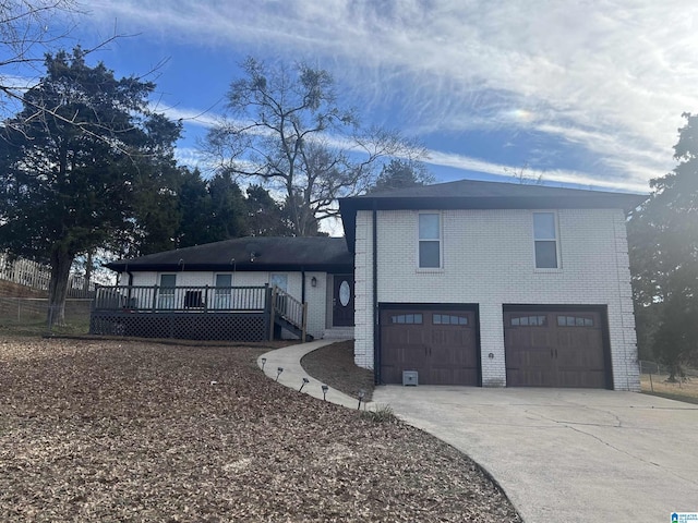 view of front of home featuring a garage and a deck