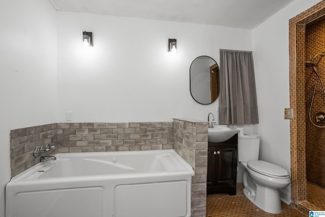 bathroom with vanity, a bath, tile patterned floors, and toilet