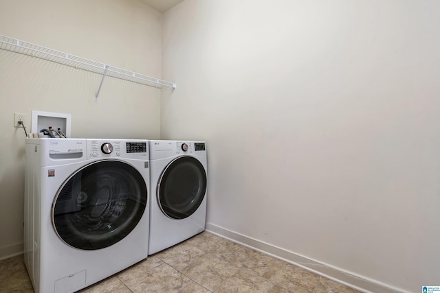 laundry room with separate washer and dryer