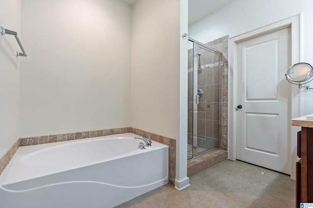 bathroom with plus walk in shower and tile patterned flooring