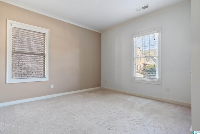 carpeted empty room with ornamental molding