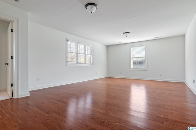 empty room featuring dark hardwood / wood-style floors