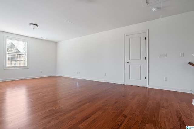 spare room with hardwood / wood-style flooring