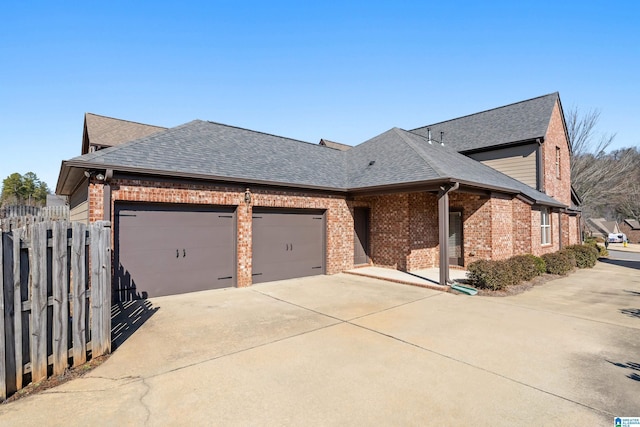 view of side of home featuring a garage