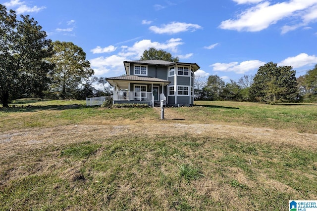 view of front of home featuring covered porch and a front lawn