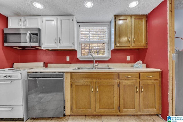 kitchen with sink, a textured ceiling, dishwashing machine, white cabinets, and white range with electric stovetop