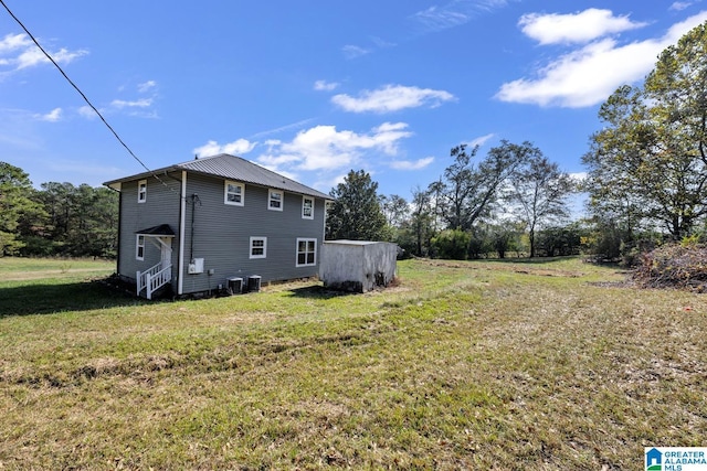 exterior space with a yard and cooling unit