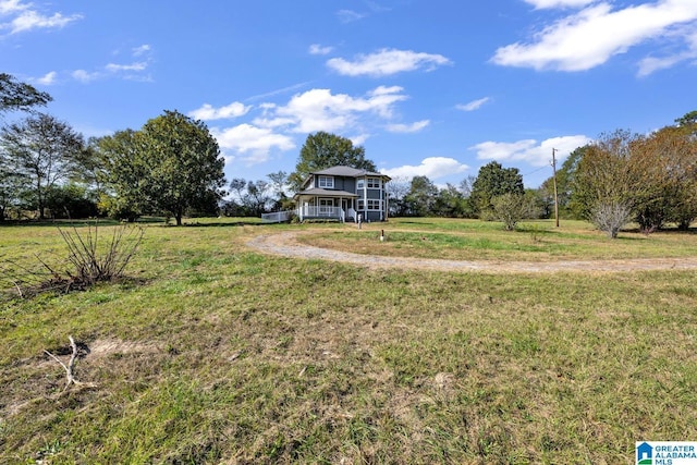 view of yard with a rural view