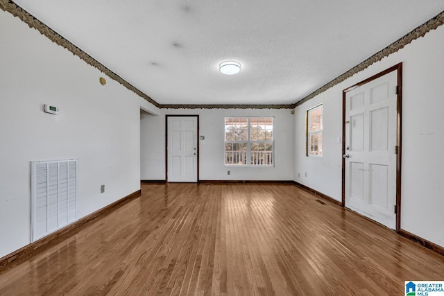 interior space featuring hardwood / wood-style floors and a textured ceiling