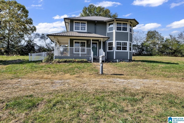 view of front of property with a front yard and covered porch