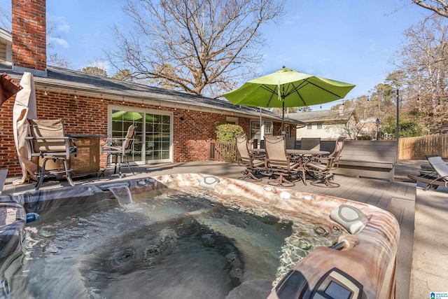 exterior space featuring a hot tub and exterior bar