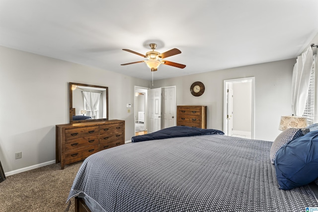 bedroom with ceiling fan, ensuite bathroom, and carpet floors