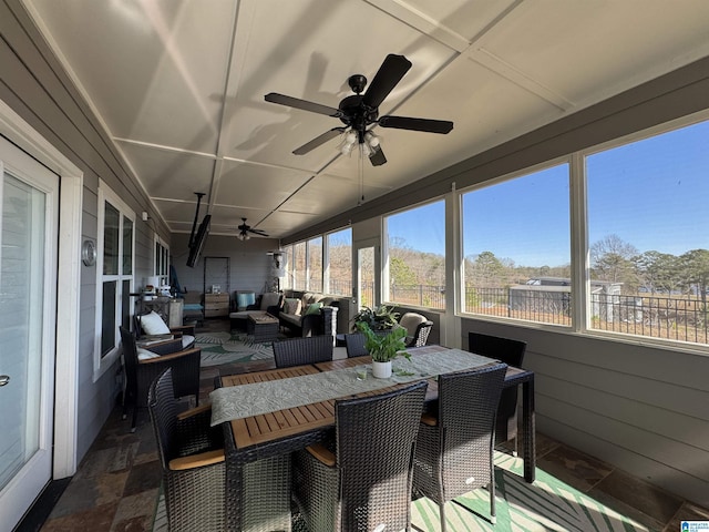 sunroom / solarium with ceiling fan