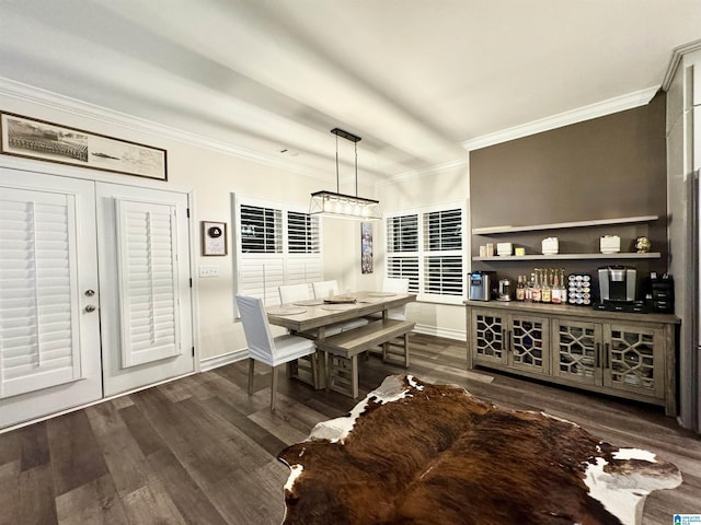 dining area with crown molding and dark wood-type flooring