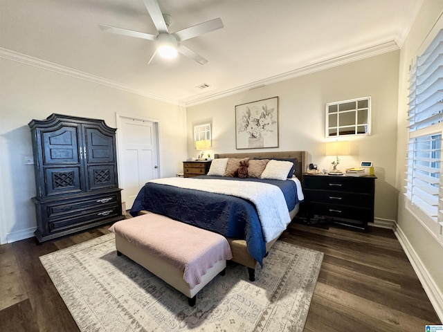 bedroom featuring dark wood-type flooring, ornamental molding, and ceiling fan