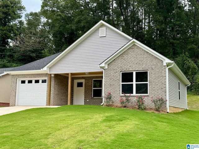 view of front of house featuring a garage and a front yard