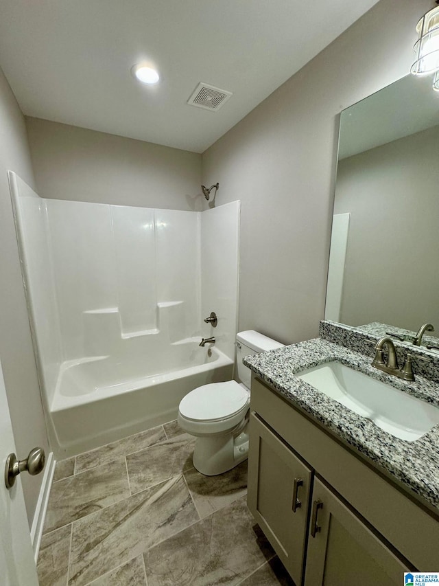 full bathroom with vanity,  shower combination, and toilet