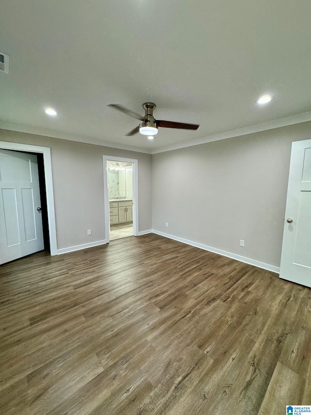 interior space featuring hardwood / wood-style flooring, ceiling fan, and crown molding