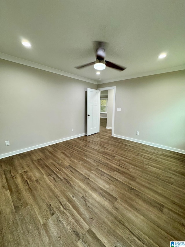 unfurnished bedroom featuring ceiling fan, ornamental molding, and dark hardwood / wood-style flooring