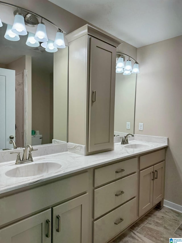 bathroom with vanity and toilet