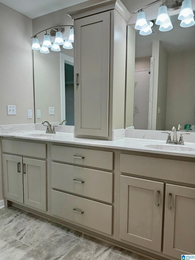 bathroom featuring vanity and a shower