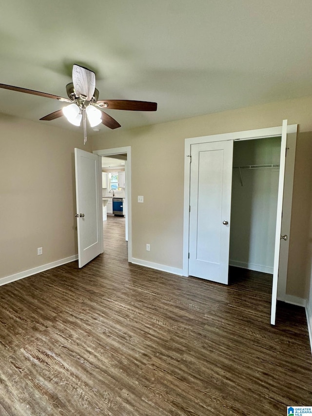 unfurnished bedroom with ceiling fan, dark hardwood / wood-style floors, and a closet