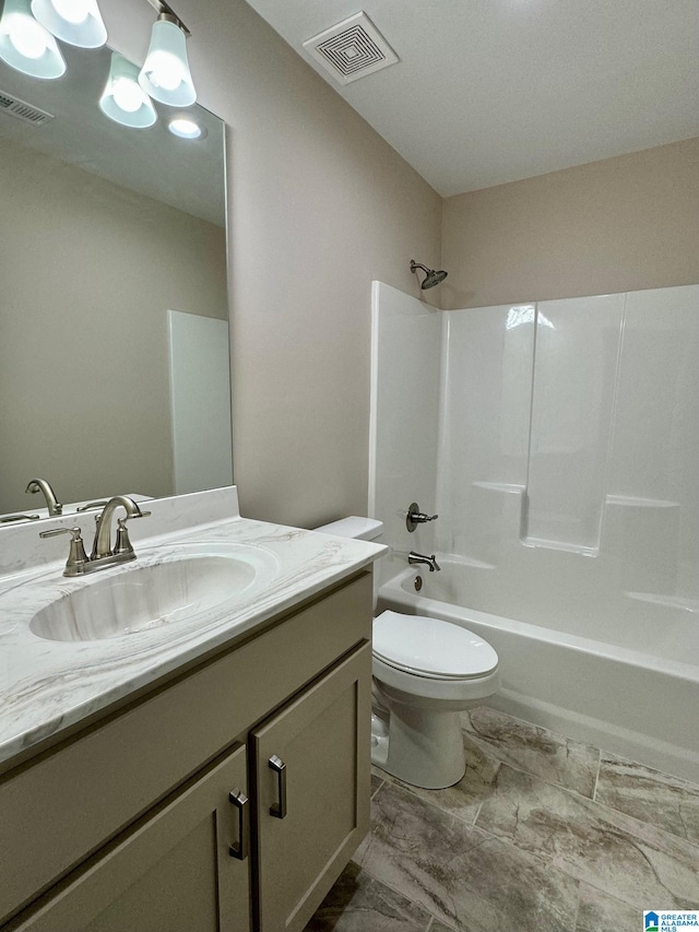 full bathroom with washtub / shower combination, vanity, and toilet