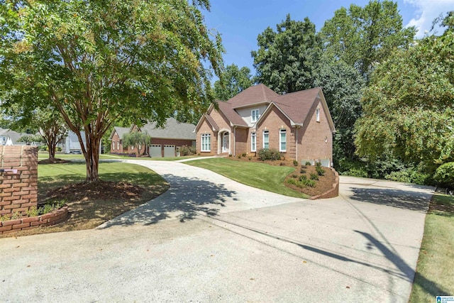 view of front of property featuring a garage and a front yard