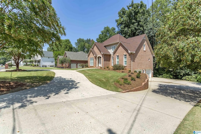 front facade with a garage and a front lawn