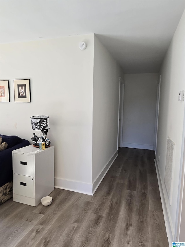 hallway with dark wood-type flooring