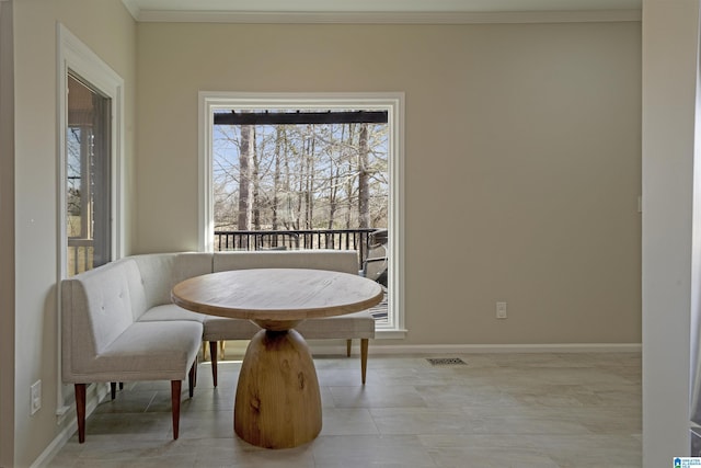 dining room featuring ornamental molding