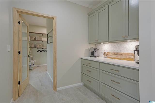 interior space featuring crown molding and decorative backsplash